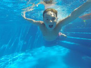 Hotel's Swimming Pool- Image of a young child in a pool