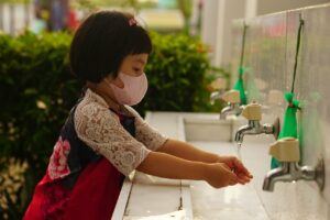 Hand Sanitizer for Commercial Use-image of a young Asian girl washing her hands 
